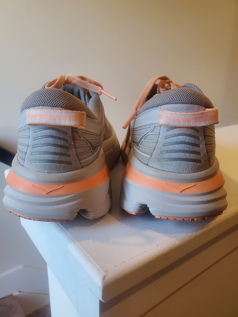 HOKA Bondi 7 running shoes in a clean gray & peach colorway - Picture 3 of 7